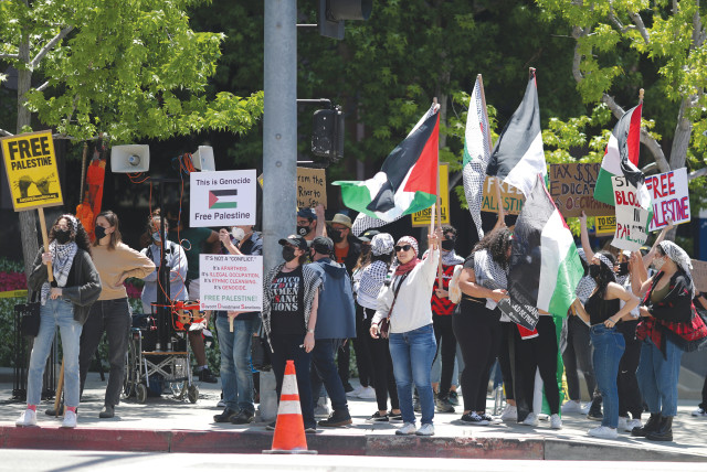  ISRAEL IS accused of genocide, at a protest outside the Israeli Consulate in Los Angeles, May 2021.  (credit: LUCY NICHOLSON / REUTERS)