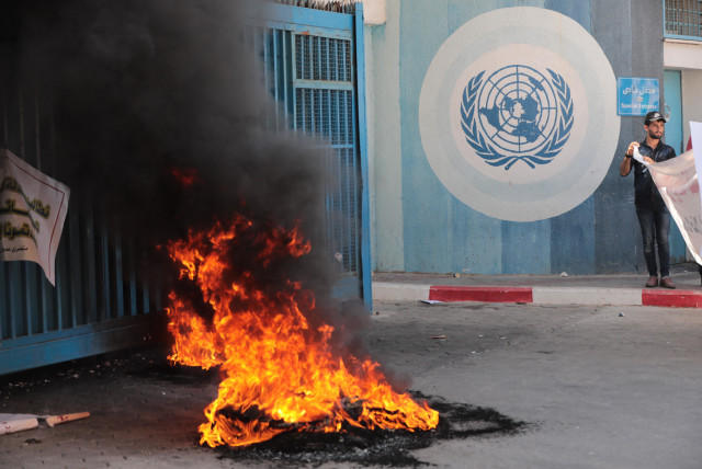 Palestinians protest demanding compensation for damaged homes in the 2014 war, outside the headquarters of UNRWA, in Gaza City, on September 5, 2022 (credit: ATTIA MUHAMMED/FLASH90)