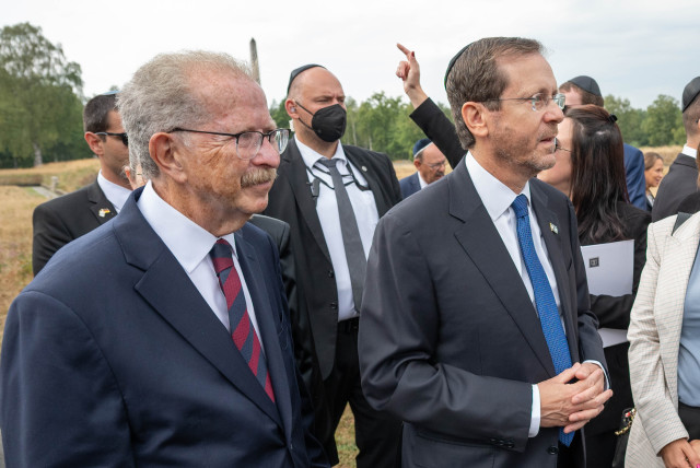  Menachem Rosensaft, left, accompanies Israeli President Isaac Herzog, right, on a visit to the Bergen Belsen concentration camp, September 6, 2022 (credit: SHAHAR AZRAN/WJC VIA JTA)