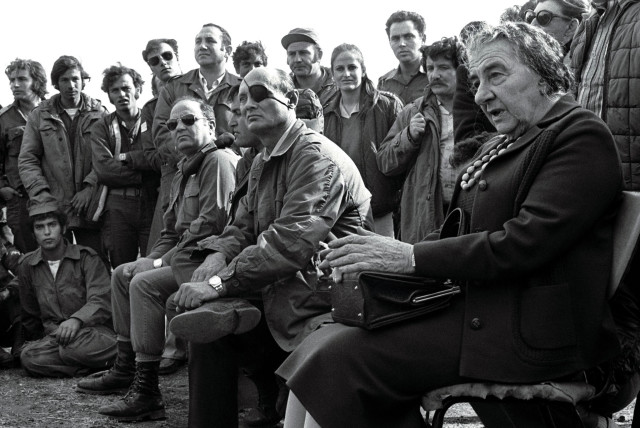  Prime minister Golda Meir, accompanied by her defense minister Moshe Dayan, meets with soldiers on the Golan Heights after the 1973 Yom Kippur War.  (credit: REUTERS)