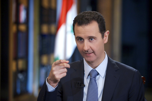 Syria's President Bashar al-Assad speaks during an interview with Turkey's Halk TV in Damascus, in this handout photograph distributed by Syria's national news agency SANA on October 4, 2013. (credit: REUTERS/SANA/HANDOUT VIA REUTERS)