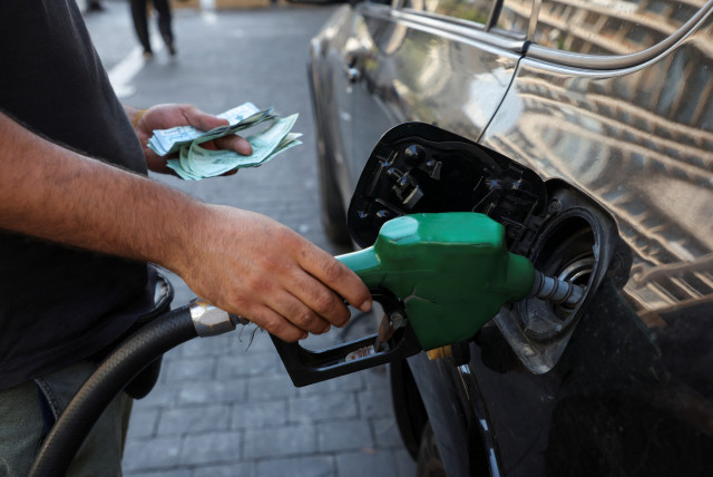 A worker fills up a car with fuel at a gas station in Beirut, Lebanon, September 12, 2022. (credit: REUTERS/MOHAMED AZAKIR)