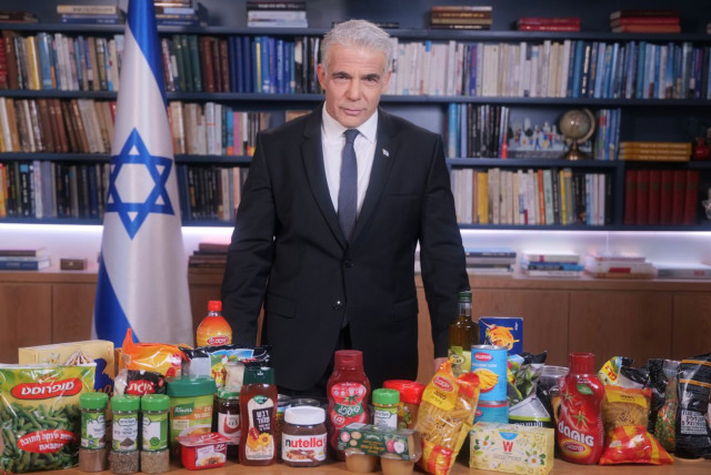 Prime Minister Yair Lapid looming over several staple Israeli food brands (credit: PRIME MINISTER'S OFFICE)