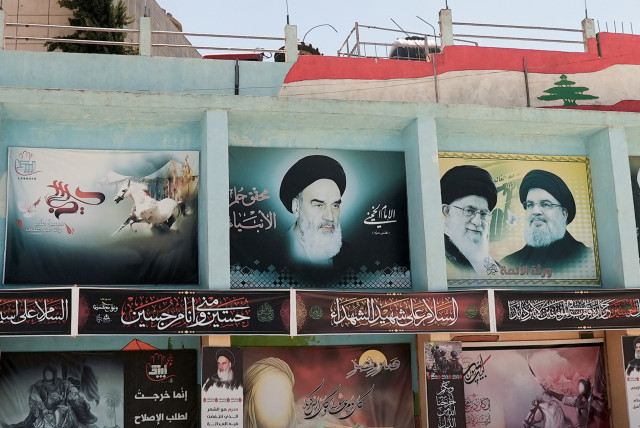  CURTAILING IRAN’S smuggling of advanced weaponry to Hezbollah: Banners depict (from L) Iran’s late leader Ayatollah Ruhollah Khomeini, Iran’s Supreme Leader Ayatollah Ali Khamenei and Hezbollah leader Sayyed Hassan Nasrallah, in Yaroun, southern Lebanon, August 15. (credit: REUTERS/ISSAM ABDALLAH)