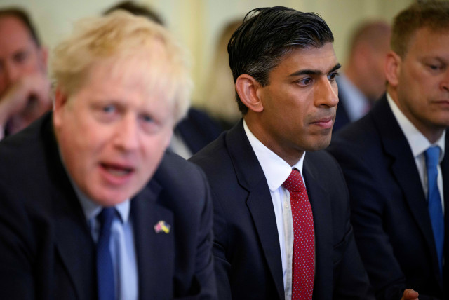  British Chancellor of the Exchequer Rishi Sunak listens as British Prime Minister Boris Johnson addresses his cabinet on the day of the weekly cabinet meeting in Downing Street, London, Britain June 7, 2022. (credit: LEON NEAL/POOL VIA REUTERS)