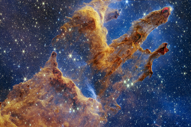  The Pillars of Creation are set off in a kaleidoscope of color in NASA’s James Webb Space Telescope’s near-infrared-light view. The pillars look like arches and spires rising out of a desert landscape, but are filled with semi-transparent gas and dust, and ever changing.  (credit: NASA)