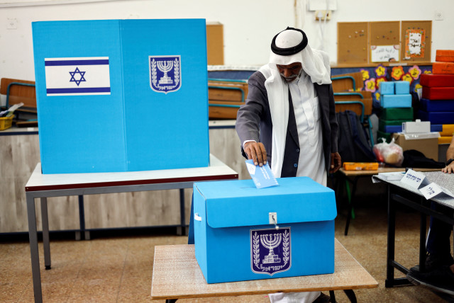  An Israeli man casting his ballot on the day of Israel's general election in a polling station in Rahat, Israel November 1, 2022. (credit: REUTERS/AMIR COHEN)