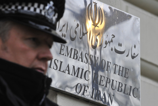  A police officer stands on duty outside the Iranian embassy in Kensington, central London December 2, 2011. (credit: TOBY MELVILLE/REUTERS)
