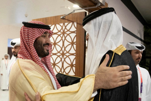  Saudi Arabia Crown Prince and Prime Minister Mohammed bin Salman is received by Qatari Emir Sheikh Tamim bin Hamad al-Thani on the sidelines of the World Cup in Doha, Qatar, November 20, 2022 (credit: VIA REUTERS)