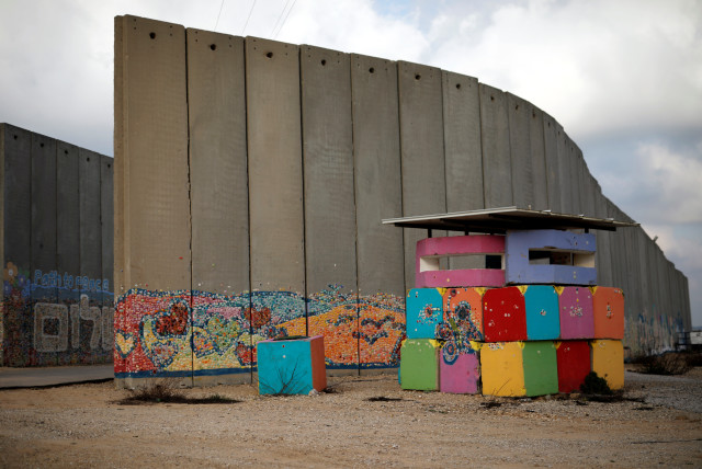 An IDF army post is seen next to a concrete wall inside the Israeli farming community of Netiv Haasara, just outside Gaza Strip by the Israeli side of the Israel-Gaza border (credit: REUTERS/AMIR COHEN)