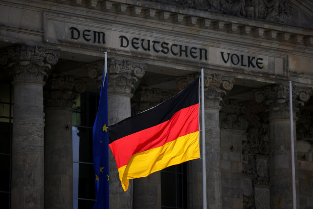  The German national flag flies in front of Reichstag building in Berlin (photo credit: REUTERS)