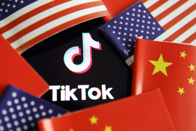  China and US flags are seen near a TikTok logo in this illustration picture taken July 16, 2020. (credit: REUTERS/FLORENCE LO/ILLUSTRATION)