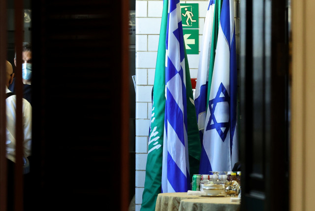  Flags of Saudi Arabia and Israel stand together in a kitchen staging area as US Secretary of State Antony Blinken holds meetings at the State Department in Washington, US, October 14, 2021. (photo credit: JONATHAN ERNST/POOL/REUTERS)