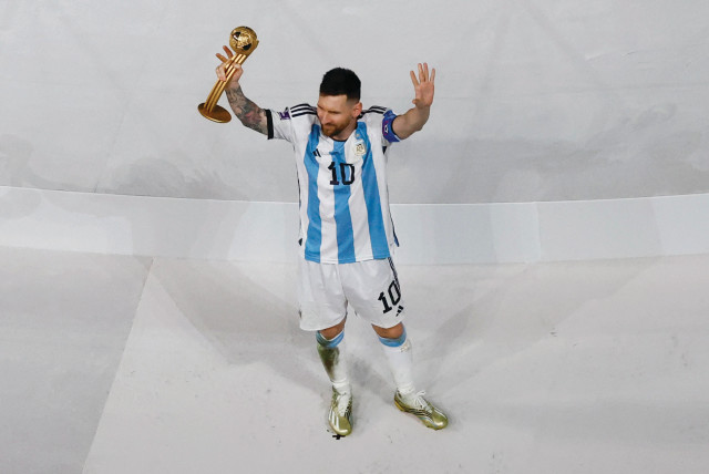  ARGENTINA’S LIONEL MESSi celebrates winning the Golden Ball award during the World Cup trophy ceremony earlier this month.  (credit: PETER CZIBORRA/REUTERS)