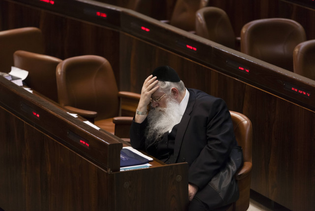 Israeli MKs of the United Torah Judaism party Meir Porush reacts as he sits in the plenum as the Knesset approves Yesh Atid's draft bill on first reading early Tuesday morning, in the Knesset, Israel's Parliament, in Jerusalem, early July 23, 2013 (credit: FLASH90)