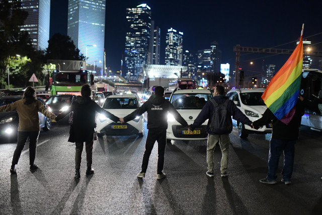  Members of the LGBT community and supporters participate in a protest against the new Israeli government, in Tel Aviv on December 29, 2022. (credit: TOMER NEUBERG/FLASH90)