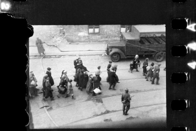  being led to Umschlagplatz; photo taken from a window of St Zofia Hospital in Warsaw. (credit: Z. L. Grzywaczewski/Family archive of Maciej Grzywaczewski/print from the negative: POLIN Museum)