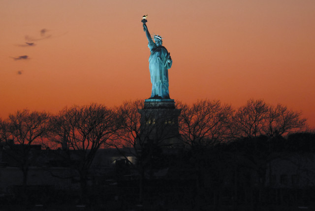  The Statue of Liberty is seen at sunset in New York City.  (credit: Andrew Kelly/Reuters)