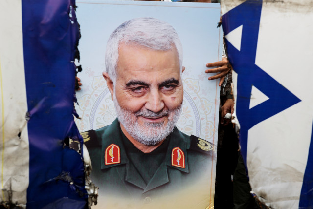  A poster of senior Iranian military commander General Qassem Soleimani is seen during a rally marking the annual Quds Day, or Jerusalem Day, on the last Friday of the holy month of Ramadan in Tehran, Iran April 29, 2022. (credit: MAJID ASGARIPOUR/WANA/REUTERS)