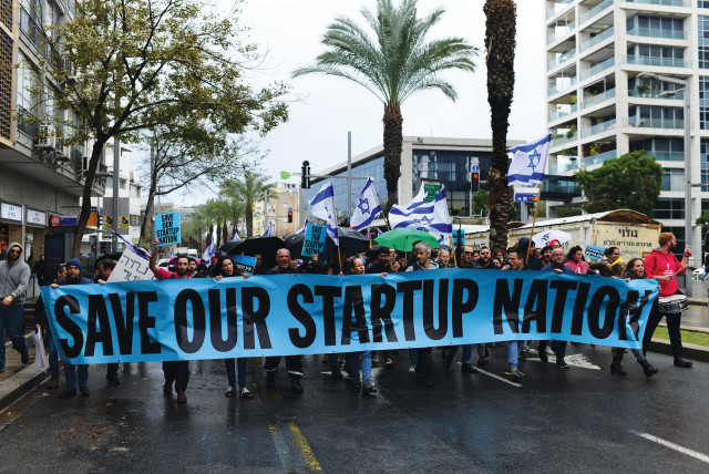  WORKERS FROM the hi-tech sector protest against the proposed changes to the legal system, in Tel Aviv, on Tuesday. (credit: TOMER NEUBERG/FLASH90)