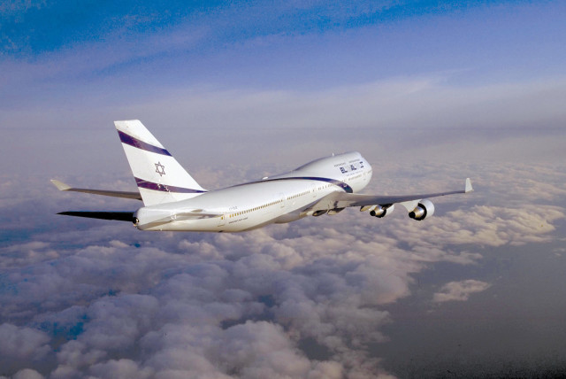  An El Al plane flying above the clouds. (credit: IPTC/GPO)