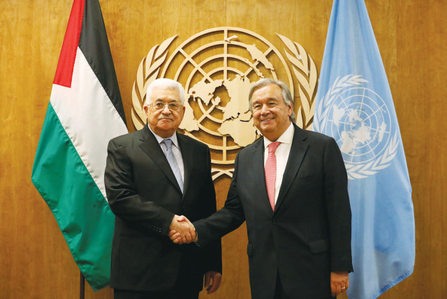  PA HEAD Mahmoud Abbas is greeted by UN Secretary-General António Guterres at UN Headquarters in New York, in 2017. Last month, Guterres pointed to the importance of restoring ‘a credible political horizon.’  (credit: BRENDAN MCDERMID/REUTERS)