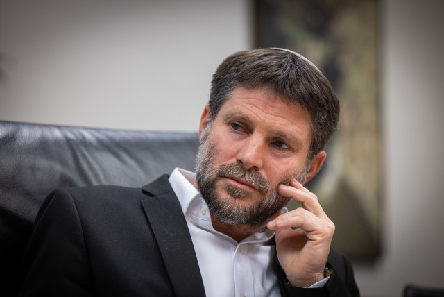 Minister of Finance Bezalel Smotrich holds a press conference with bereaved families in the Ministry of Finance in Jerusalem on January 8, 2023.  (credit: YONATAN SINDEL/FLASH90)
