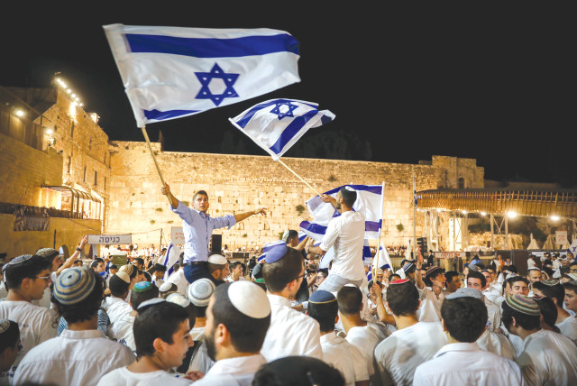  CELEBRATIONS TAKE place at the Western Wall marking Jerusalem Day, last May. Israel scored high because our dedication to Zionism or religious beliefs makes life here meaningful and satisfying. (credit: NOAM REVKIN FENTON/FLASH90)
