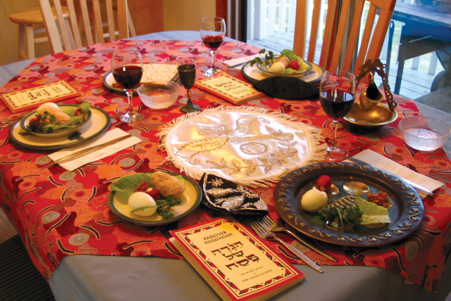  A traditional Seder table setting. (credit: WIKIPEDIA)