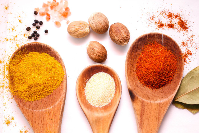  (Right to left) Curry powder, garlic powder and chili powder on wooden spoons (credit: FLICKR)