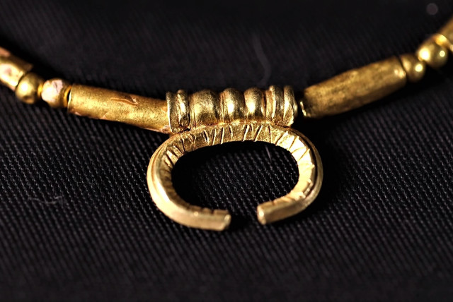  A pendant with the sign of Luna, Roman goddess of the moon. (credit: EMIL ALADJEM/IAA)