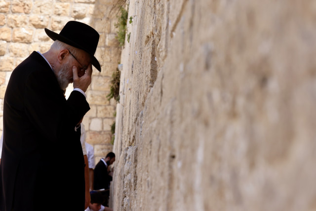  A man prays at the Western Wall in the Old City of Jerusalem.  (credit: MARC ISRAEL SELLEM)