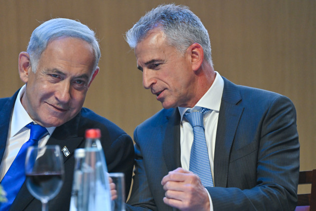  Israeli Prime Minister Benjamin Netanyahu is seen next to Mossad Director David Barnea at a pre-Passover toast, on April 4, 2023. (credit: KOBI GIDEON/GPO)
