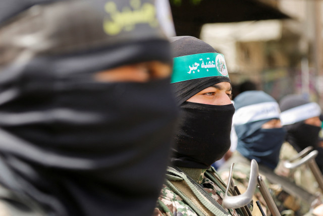  Palestinian militants attend Hamas rally Solidarity with Al-Aqsa in Jabalia, northern Gaza April 7, 2023 (credit: REUTERS/AARAFAT BARBAKH)