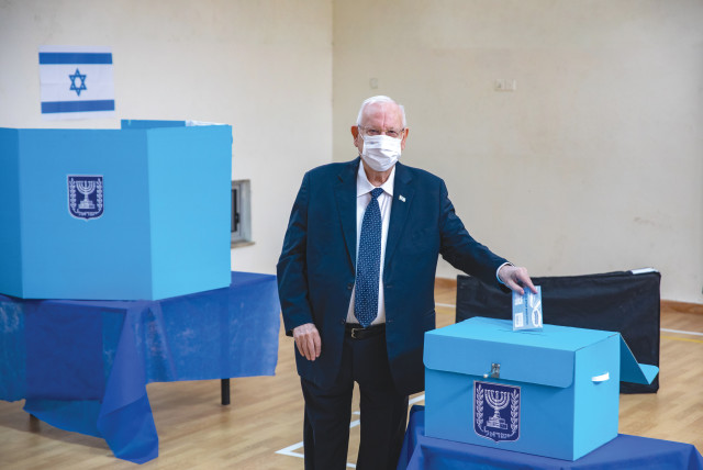  THEN-PRESIDENT Reuven Rivlin votes in the Knesset election, in Jerusalem, in March 2021. Voting in Israel is solely limited to a single ballot cast for a political party, not an individual.  (credit: OLIVIER FITOUSSI/FLASH90)