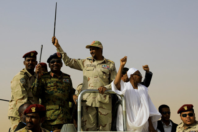  Lieutenant General Mohamed Hamdan Dagalo, deputy head of the military council and head of paramilitary Rapid Support Forces (RSF), greets his supporters as he arrives at a meeting in Aprag village, 60 kilometers away from Khartoum, Sudan, June 22, 2019. (credit: REUTERS/UMIT BEKTAS/FILE PHOTO)