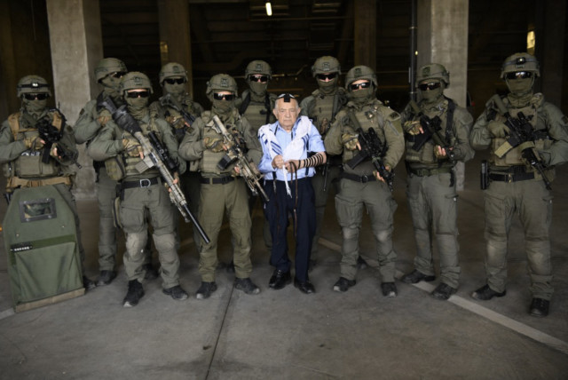 Jerusalem Border Police pose for a photo with their adopted Holocaust survivor, Ezekiel  (credit: ISRAEL POLICE SPOKESPERSON'S UNIT)