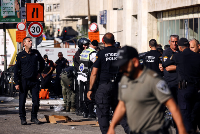  Israeli security forces and rescue workers work at the scene following a ramming terror attack by Jerusalem's Mahane Yehuda market, April 24, 2023 (credit: REUTERS/Ronen Zvulun)