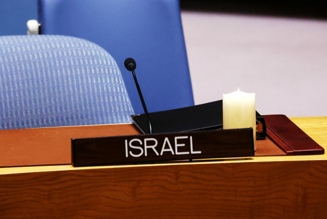  A candle left by Israel’s Ambassador to the United Nations Gilad Erdan to commemorate Israel’s Remembrance Day after Erdan left, on April 25, 2023. (credit: REUTERS/MIKE SEGAR)