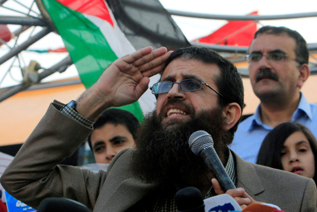 FILE PHOTO: Palestinian Islamic Jihad leader Khader Adnan gestures as he speaks during a rally honoring him following his release, near the West Bank city of Jenin July 12, 2015.  (credit: REUTERS/ABED OMAR QUSINI/FILE PHOTO)