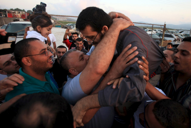  Islamic Jihad leader Khader Adnan is greeted upon his release from an Israeli jail, in the West Bank village of Arabeh near Jenin July 12, 2015.  (credit: REUTERS/STRINGER/FILE PHOTO)