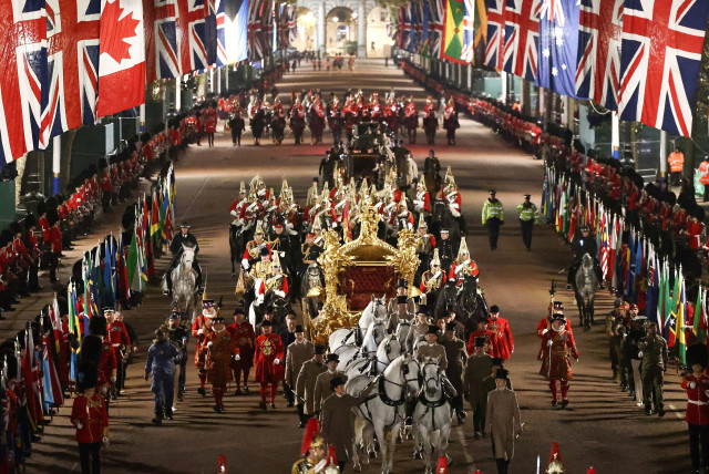  IN A full overnight coronation dress rehearsal, the Gold State Coach is ridden alongside members of the military, May 3. (credit: HENRY NICHOLLS/REUTERS)