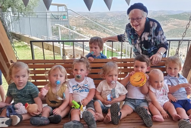  AT HER 85th birthday party in Peduel with eight of her great-grandchildren.  (credit: Courtesy Sarah Goodman)