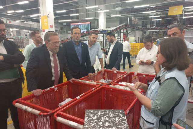 Members of the Knesset Special Committee for Public Inquiries on a tour of Israel Post facilities, May 4, 2023. (credit: KNESSET SPOKESMAN'S OFFICE)