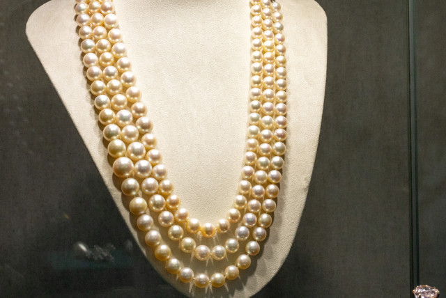 A Three Strand Natural Pearl Necklace by Harry Winston is seen during a preview of the 700-piece jewellery collection of the late Austrian billionaire Heidi Horten at Christie’s before the auction sale in Geneva, Switzerland, May 8, 2023 (credit: DENIS BALIBOUSE/REUTERS)