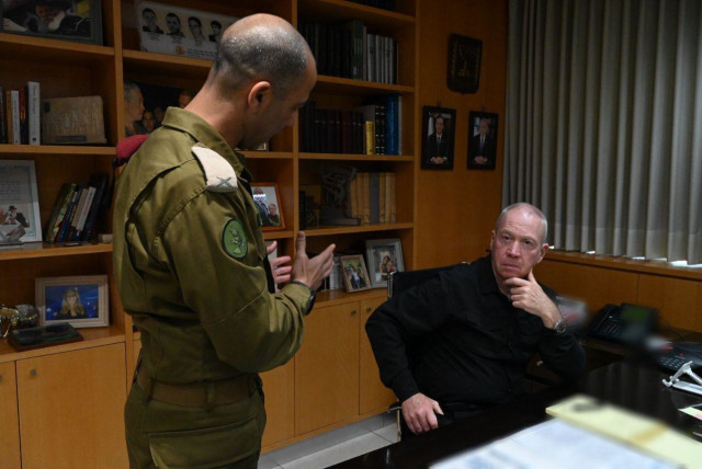  Defense Minister Yoav Gallant speaks with an IDF official at the start of Operation Shield and Arrow, May 9, 2023. (credit: ARIEL HERMONI/DEFENSE MINISTRY)