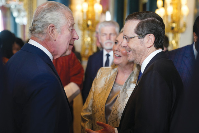  BRITAIN’S KING Charles chats with President Isaac Herzog and his wife, Michal, during a reception for overseas guests attending his coronation, at Buckingham Palace last week. (credit: REUTERS)