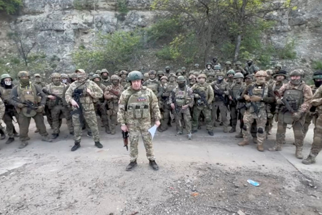  Founder of Wagner private mercenary group Yevgeny Prigozhin makes a statement as he stand next to Wagner fighters in an undisclosed location in the course of Russia-Ukraine conflict, in this still image taken from video released May 5, 2023. (credit: PRESS SERVICE OF ''CONCORD''/HANDOUT VIA REUTERS)