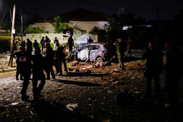  Security and rescue personnel work at the site where a rocket fired from Gaza landed in Ashkelon, Israel May 10, 2023 (photo credit: REUTERS/AMIR COHEN)