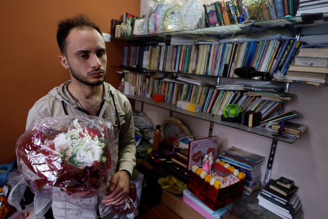Palestinian man Mohammad Saed, whose fiancee Dania Adas was killed in a nearby Israeli strike that damaged her family's house, displays presents he gifted to her, inside her house in Gaza City May 10, 2023. (credit: MOHAMMED SALEM/REUTERS)